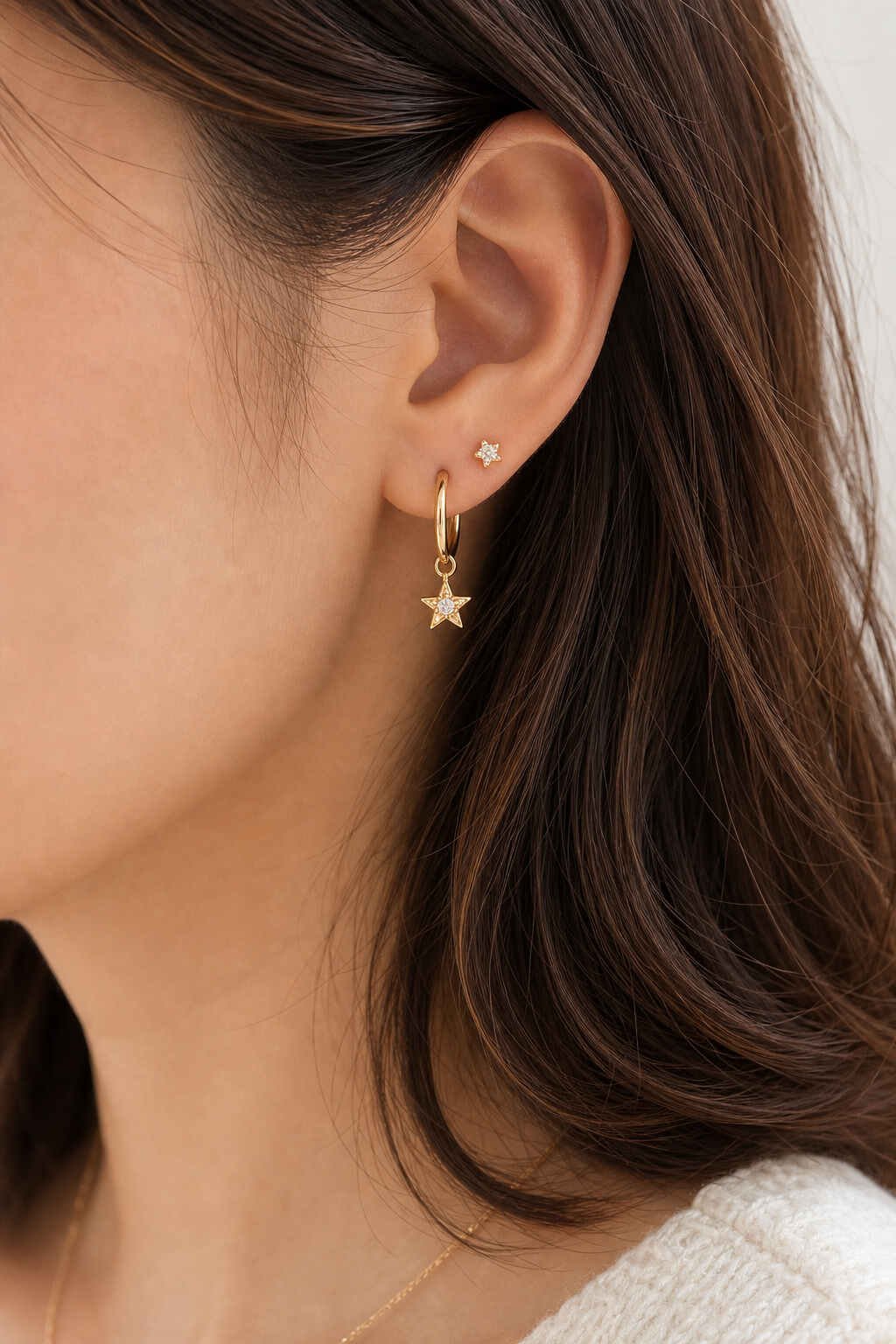 cute dangly earrings on ear – gold hoop and stud